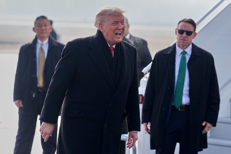 President Donald Trump, center, speaks as he steps off Air Force One after arriving at Zurich International Airport for the World Economic Forum, Wednesday, Jan. 21, 2026, in Zurich, Switzerland. (AP Photo/Evan Vucci)