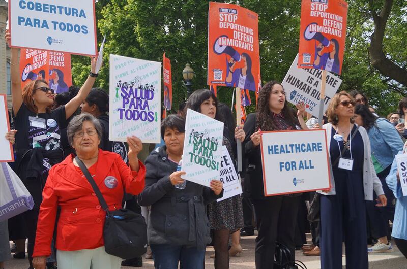 Demonstrators outside the Illinois Statehouse rally for immigrant rights during the 15th annual Latino Unity Day on Thursday, May 8, 2025.