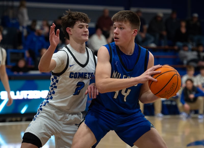 Milford's Jack VanHoveln controls the ball as Clifton Central's Kaden Neveu, left, guards during a Class A Regional game on Monday, Feb. 23, 2026.