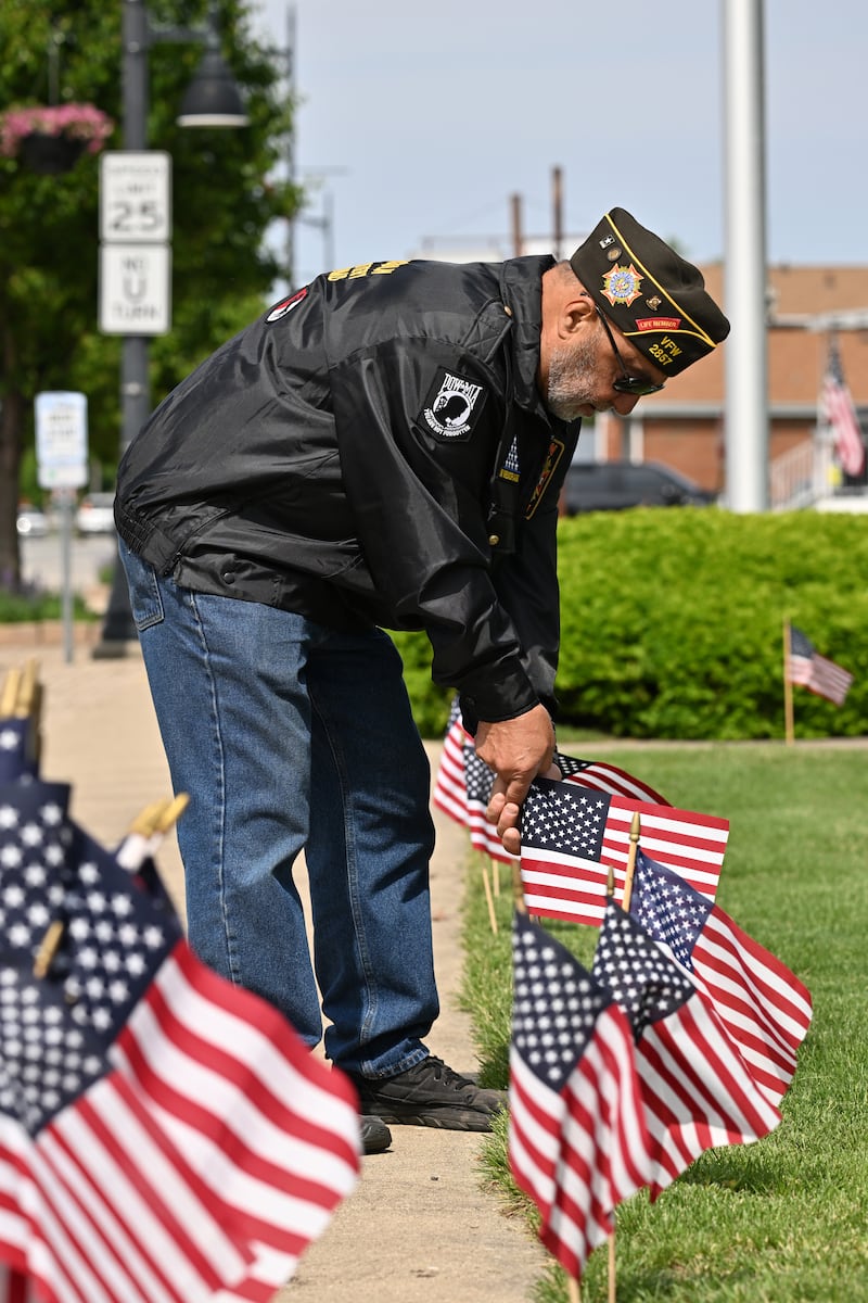 Nick Monacelli, of Kankakee, helps decorate the Bradley American Legion Post 766 for Memorial Day on Saturday, May 24, 2025.