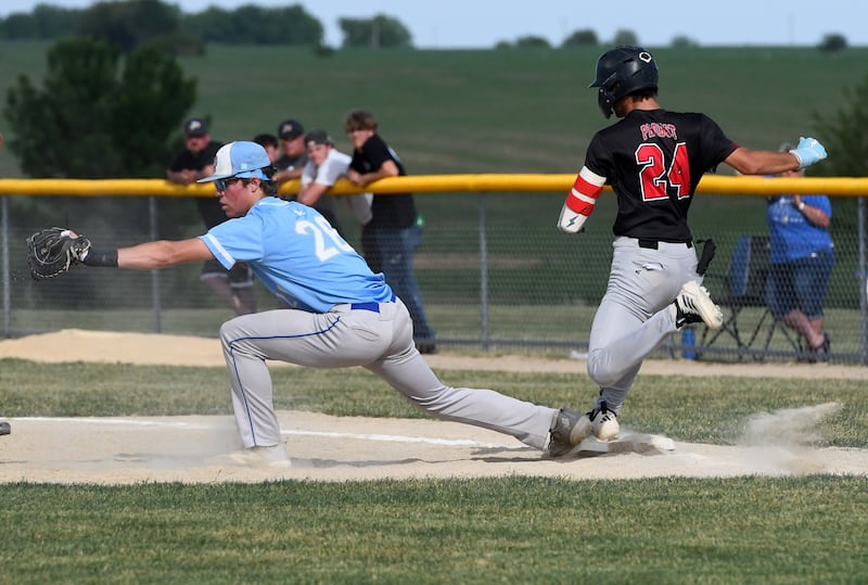 Forreston's Mickey Probst tries to beat out a throw as Galena first baseman Drew Koenings makes the catch for an out at the 1A Forreston Sectional on Wednesday, June 3, 2026.