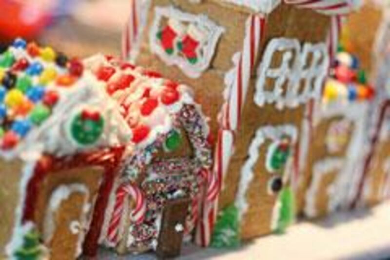 Graham crackers, Royal Icing and a variety of candies are the necessary elements for making memories — and a “gingerbread” village — this holiday season. (Herald Photo by Adam Nekola)