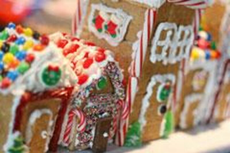 Graham crackers, Royal Icing and a variety of candies are the necessary elements for making memories — and a “gingerbread” village — this holiday season. (Herald Photo by Adam Nekola)