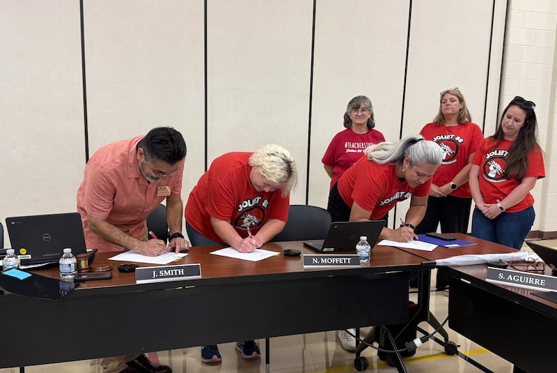 Board of School Inspector President Jesse Smith, Council #86 of the American Federation of Teachers - Local 604 President Therese Skwarczynski, and Secretary Vanessa Gomez sign the contract during the September school board meeting. 
Wednesday, Sept. 10, 2025.