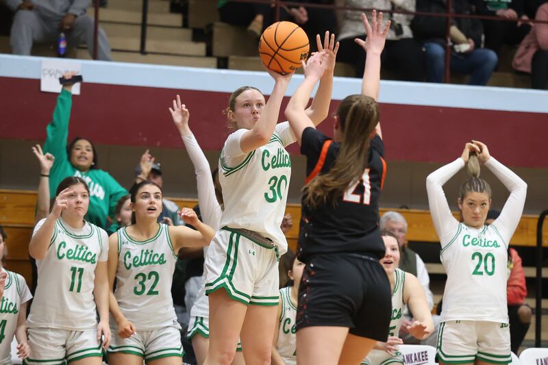 Providence’s Kennady Kotowski takes the outside shot against Washington in the Class 3A Kankakee Super-Sectional game on Monday, March 3, 2026 in Kankakee.