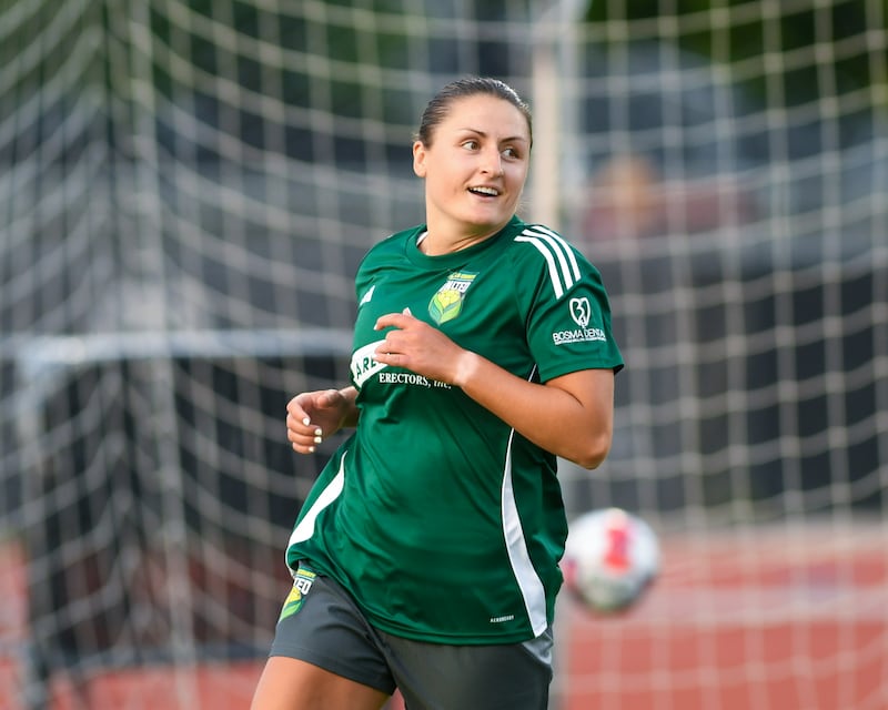 DeKalb County United's Natalie Vaugh-Low (8) is all smiles after making a goal during the game on Wednesday June 11, 2025, while taking on Edgewater held at Northern Illinois university’s soccer stadium in DeKalb.