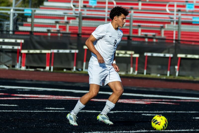 Minooka's Andrew Calderon scans the field during a varsity soccer away game against Bolingbrook on Sept. 16, 2025.