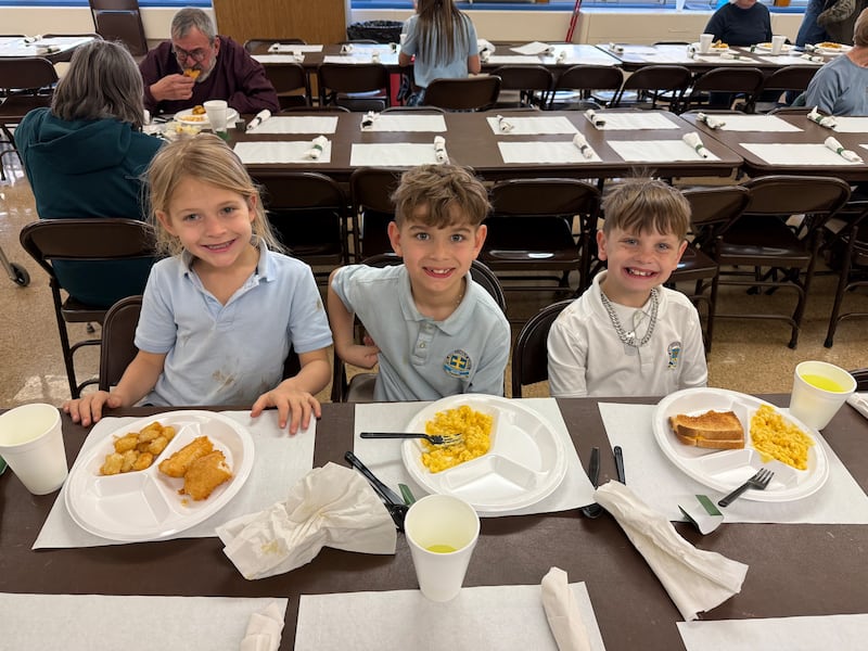 Three St. Anne Catholic School students enjoy their meals at the Feb. 27 Fish Fry held at the school in Dixon. The next Fish Fry is scheduled for 4 - 7 p.m. March 13.