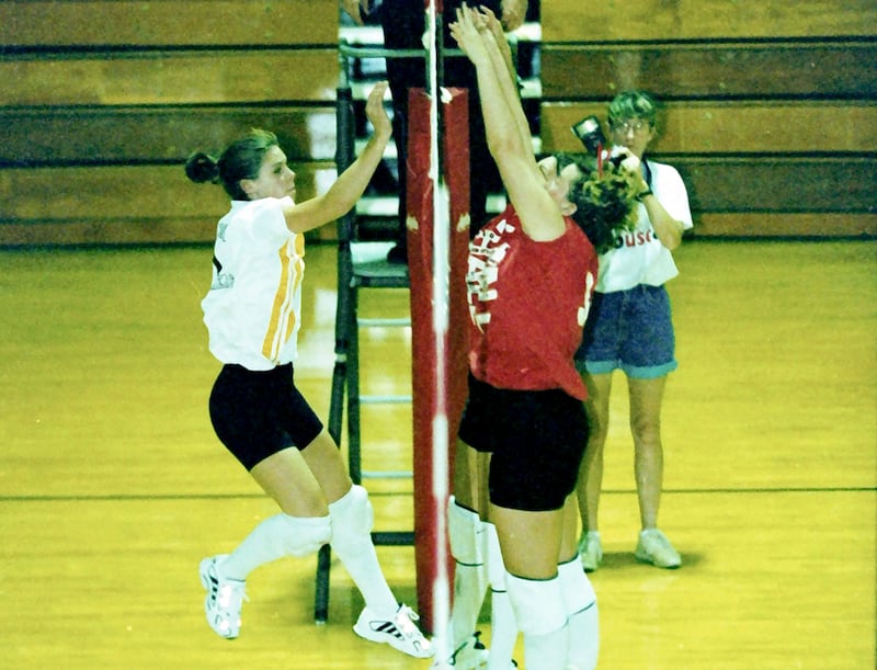 Putnam County's Dani Zellmer (left) takes a swing against Hall in the 1998 sectional championship. The Lady Panthers won to advance to the Sweet 16 for the first time. The former PC standout/Hall coach passed away this week at 45.