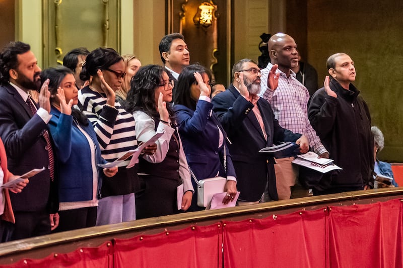 New U.S. citizens take the Oath of Allegiance during the Naturalization Ceremony at Rialto Square Theatre in Joliet on April 17, 2025.