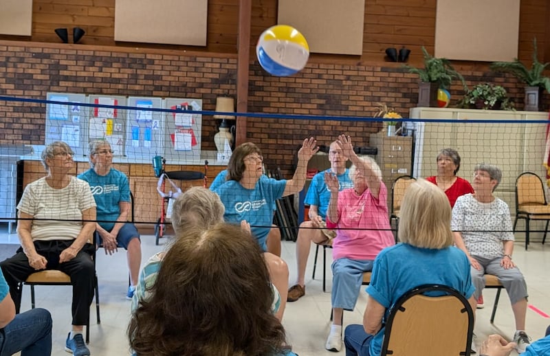 Seniors play a game of chair volleyball at the Beecher Center in Yorkville.
