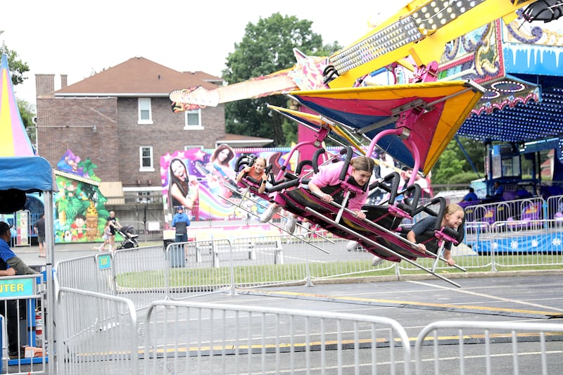 Riders fly through the air during a rainy opening day of the 75th Annual Swedish Days on Wednesday, June 18, 2025, in Geneva.