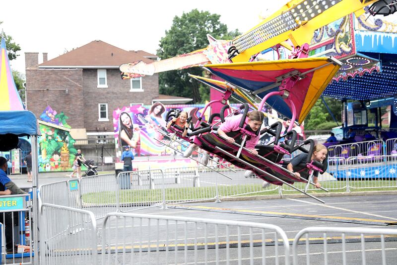 Riders fly through the air during a rainy opening day of the 75th Annual Swedish Days on Wednesday, June 18, 2025, in Geneva.