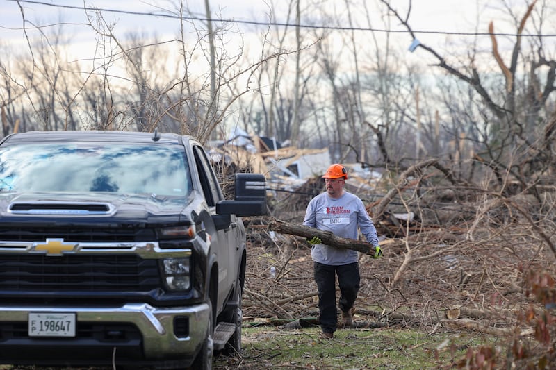 Team Rubicon member Doc Kirk, a veteran of Mt. Pulaski, assists with debris removal in the Oakwoods subdivision in Aroma Township on March 19, 2026 following the March 10 tornado.