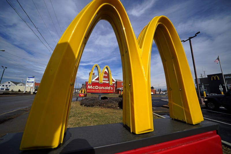 FILE - McDonald's restaurant signs are shown in in East Palestine, Ohio, Feb. 9, 2023. McDonald's reports earning on Monday, July 29, 2024. (AP Photo/Gene J. Puskar, File)
