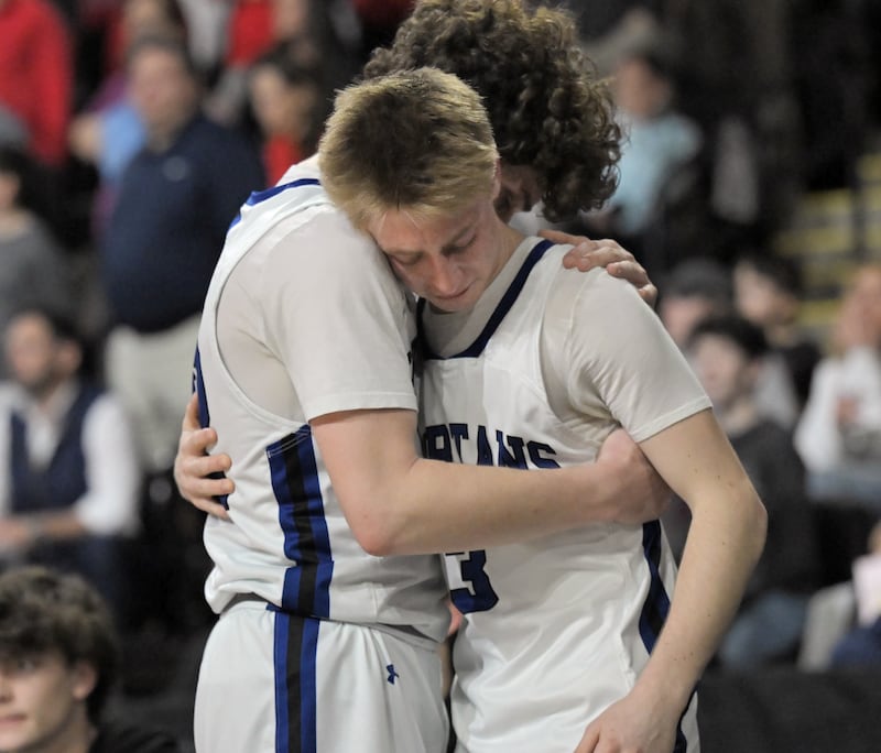 St. Francis’ Luke Dufresne and Jack Bratthauar, right, react to their loss to Deerfield in the IHSA Class 3A supersectional championship game at the Now Arena in Hoffman Estates on Monday, Mar. 9 2026.