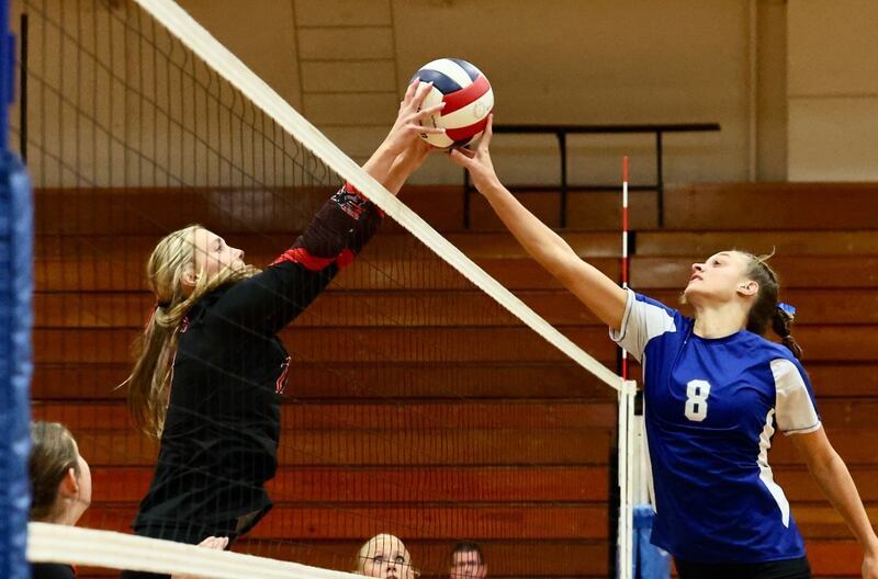 E-P's Lauren Abbott stuffs Princeton Keighley Davis Monday night at Prouty Gym. E-P won 25-13, 25-15.