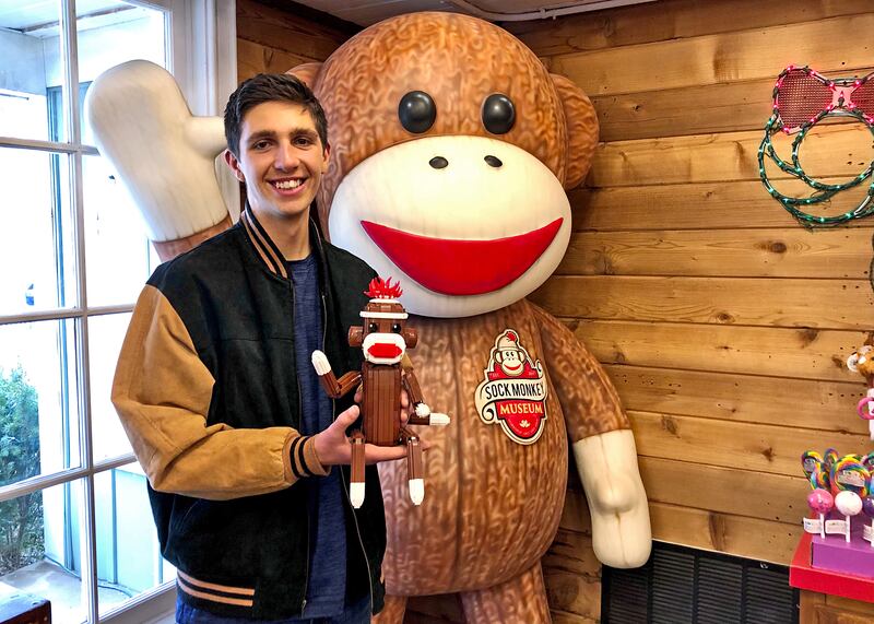 Nathan Lilliebridge with his Lego creation "Harry" that is now permanently displayed at the Sock Monkey Museum in Long Grove.