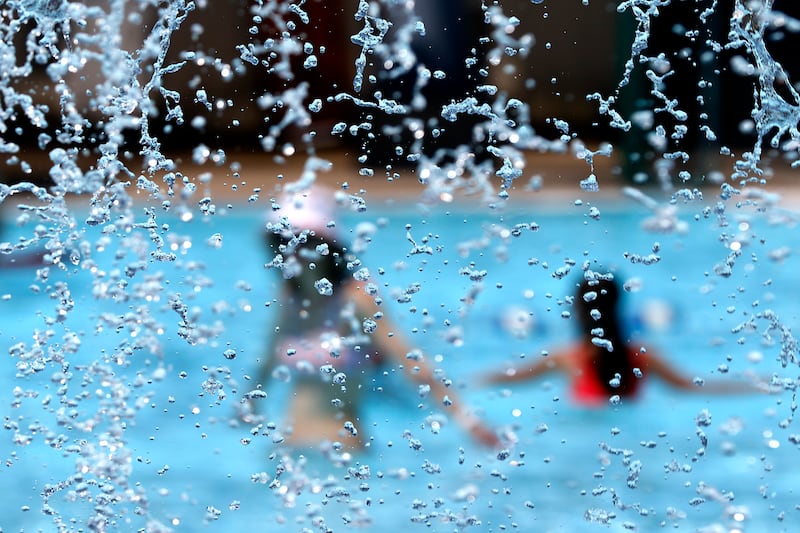 People enjoy the water while swimming on Friday, June 21, 2024, at Woodstock Water Works.