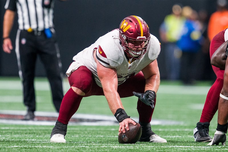 Washington Commanders center Tyler Biadasz (63) lines up during the second half of an NFL football game against the Atlanta Falcons, Sunday, Sep. 28, 2025, in Atlanta. (AP Photo/Danny Karnik)