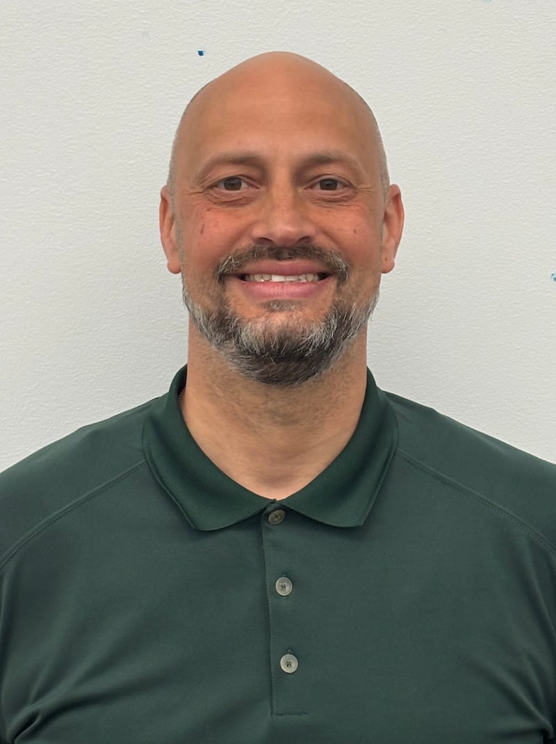 Oswego East boys basketball coach Brian Johnson