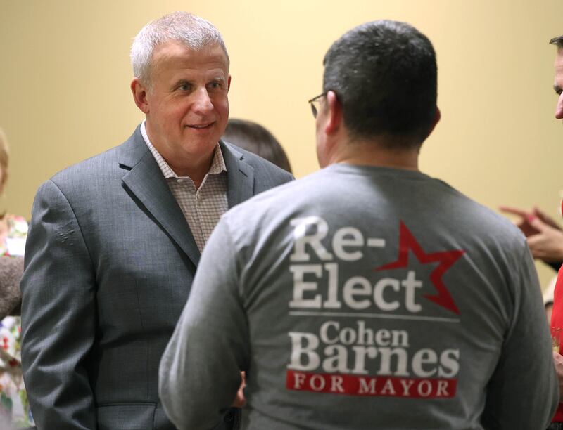 DeKalb Mayor Cohen Barnes, who is running for reelection, talks to a supporter Tuesday, April 1, 2025, during an election night watch party at Faranda's Banquets in DeKalb.