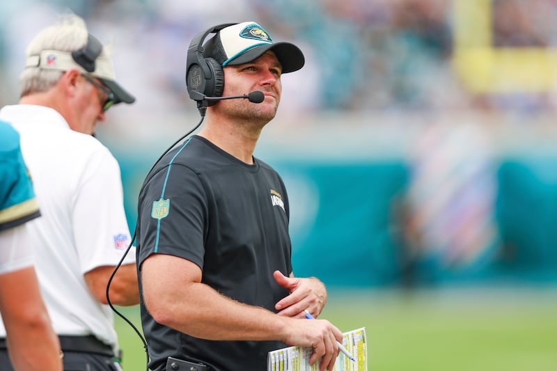 Former Jacksonville Jaguars offensive coordinator Press Taylor walks the sideline during an NFL football game against the Indianapolis Colts a few years ago in Jacksonville, Florida. The Bears reportedly promoted Taylor to be their offensive coordinator Sunday.