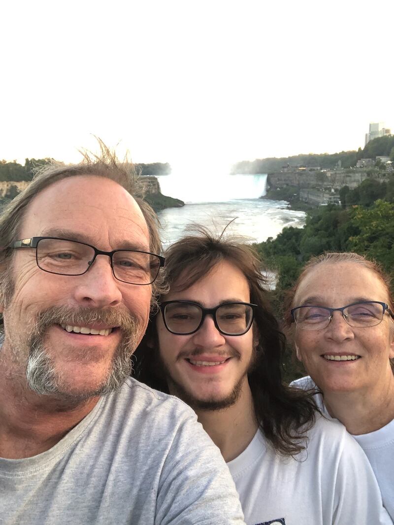 Dan, Nick, and Cathy Lindblad pose for a selfie on vacation.