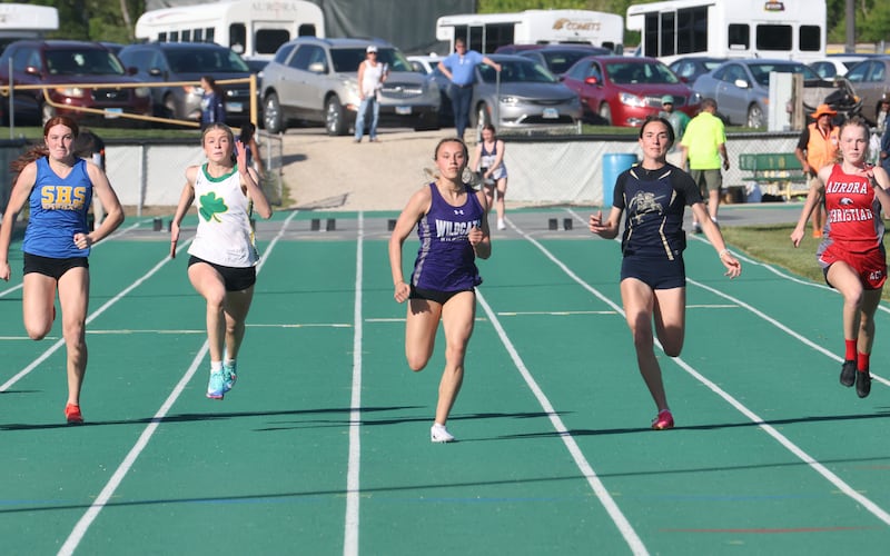 (From left) Somonuak's Ella Roberts, Seneca's Eila Coleman, Wilmington's McKenna Van Tilburg, Marquette's Madisyn Trainor, and Aurora Christian's Grace Knight compete in the 100 meter dash during the Class 1A Sectional meet on Thursday, May 14, 2026 at Seneca High School.