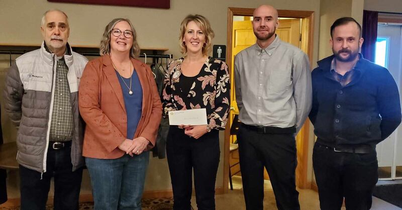 (From left) Mark Pratt and Christine Pratt with Western Bureau County Food Pantry, Tracy Grimmer (Rotary Club grant committee chair) and Sky Abrassart and Daniel Elmore with Elmore Disaster Relief pose for a photo after receiving a Love Our Community grant program.