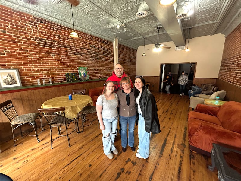 Paula and Derrick Porter and two of their children, Skyler Kelley and Vivyan Porter, stand in one of the rooms of the After Teen Lounge at 117 N. Fourth St. in Oregon during an informational open house on Sunday, Feb 22, 2026. The Porters are transforming a vacant downtown Oregon business into a place where area teenagers can gather.