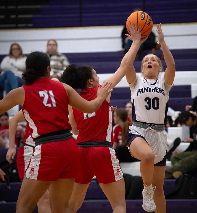 Manteno's Kendall Blanchette elevates for a shot as Streator's Lahla Thompson guards in a game on Monday, December 8, 2025.