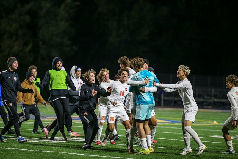 Lincoln-Way West rushes the pitch to celebrate their win over Joliet Central in their Class 3A Joliet Central Regional semifinal soccer match between Lincoln-Way West at Joliet Central, Wednesday Oct 22, 2025.