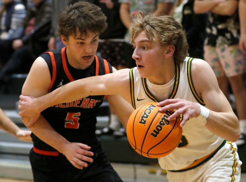 Crystal Lake South's Carson Trivellini tries to drive the baseline against McHenry's Kyle Maness during a Fox Valley Conference basketball game on Friday, Jan. 31, 2025, at Crystal Lake South High School.