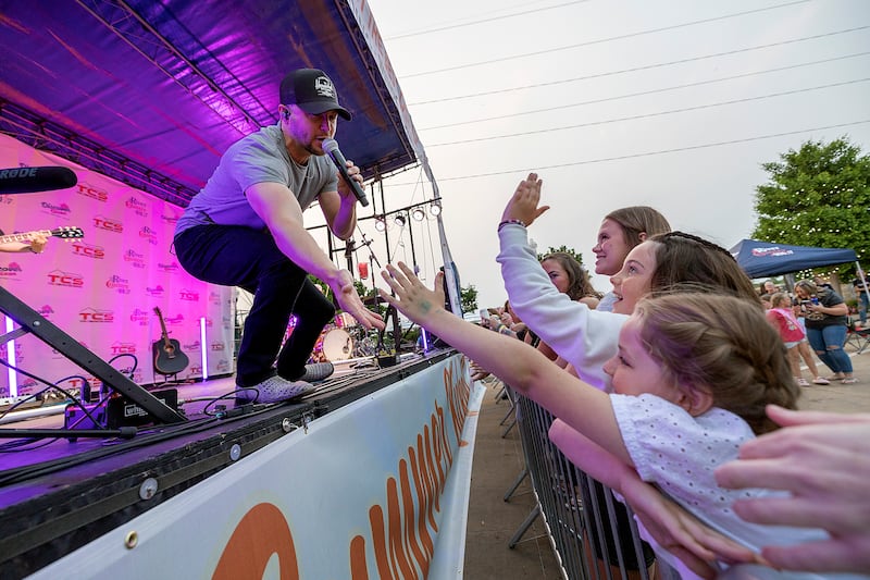 Headliner Kelsey Hart greets young fans Saturday, May 31, 2025, at the River Country Summer Kickoff 2025 in Dixon.