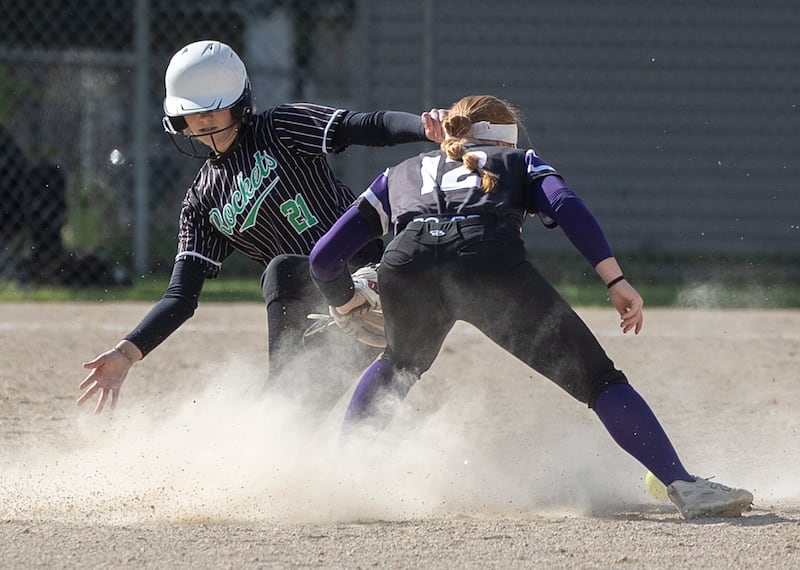Rock Falls’ Madisyn Eikenberry slides in safe on a steal at second against Dixon Thursday, May 7, 2026.
