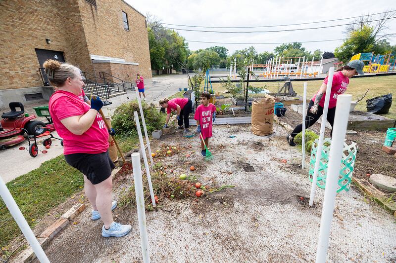Between explorations of interesting bugs and insects, Kam Horton, 7, of Dixon helps clear up the garden Saturday, Sept. 13, 2025, during United Way of Lee County’s Day of Caring.