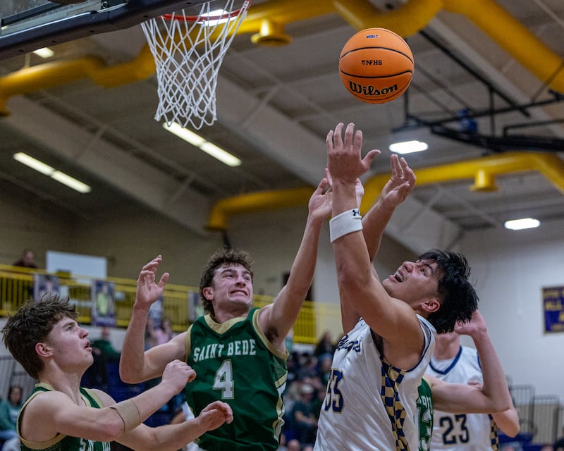 Marquette's Blayden Cassel (33) and St. Bede's Gino Ferrari (4) reach for rebound during the Class 1A Regional Boys Basketball Championship game on Friday, Feb. 27, 2026 at Serena High School.
