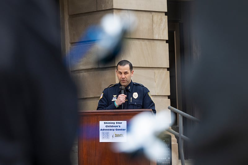 Dixon Deputy Police Chief Aaron Simonton speaks to a crowd Friday, April 10, 2026, during a Hands Around the Courthouse event hosted by Shining Star Children’s Advocacy Center to raise awareness of child abuse.