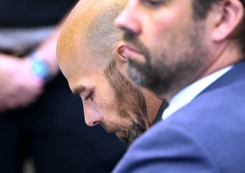 Nathan P. Sweeney, (left) 45, of DeKalb, looks down with his attorney John Kopp Thursday, June 26, 2025, as lead prosecutor Scott Schwertley recounts the details of the 2024 crash during his plea hearing at the DeKalb County Courthouse in Sycamore. Sweeney pleaded guilty Thursday for driving under the influence on March 28, 2024, and causing a crash that killed DeKalb County sheriff‘s deputy Christina Musil.