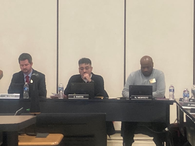 Joliet Public Schools District 86 Board President Jesse Smith (center) addresses the community after the termination of Jeremy Ledesma on Wednesday, Jan. 14, 2026.