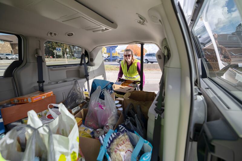 Indivisible Sauk Valley member Alissa Kirchner loads food into a van Saturday, Nov. 1, 2025, at a protest in Sterling. The group organized a food drive in conjunction with their protest to help stock the Sauk Valley Food Bank. “The people have been very generous,” said  Kirchner about the amount of food donated during the day.