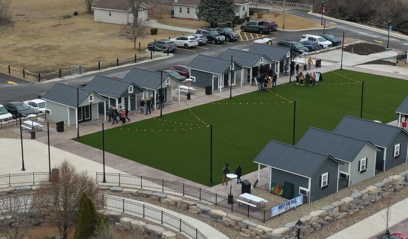 Wine enthusiasts attend the Winter Wine Walk on Saturday, Feb. 8, 2025 at the Market on Mill plaza in Utica.