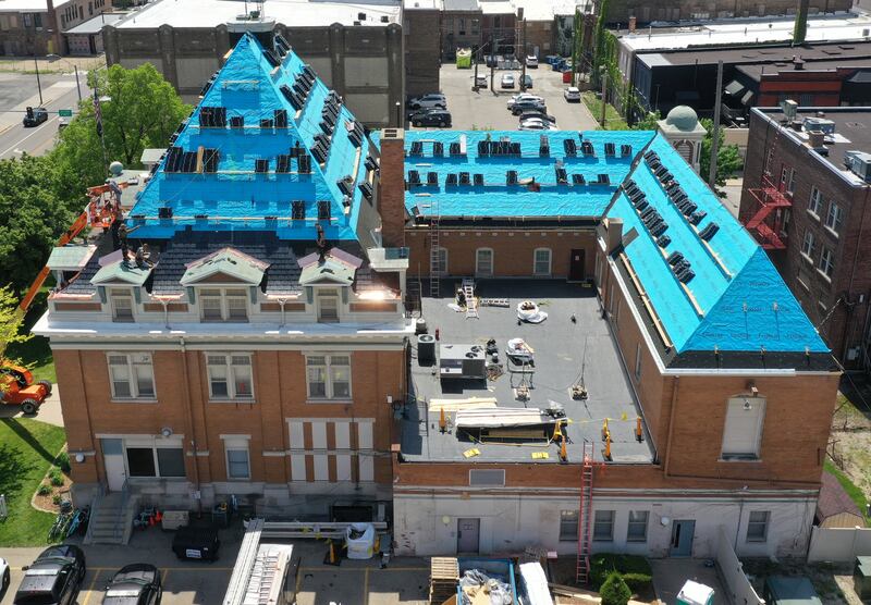 An aerial view of the La Salle City Hall building as crews begin to shingle it on Thursday, May 11, 2023 in La Salle.