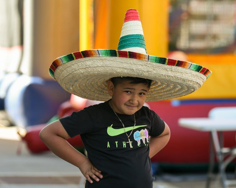 Matteo Contreras, 7, is all smiles after spotting the camera during the second annual Cinco de Mayo Celebration in downtown DeKalb on Sunday, May 5, 2024.