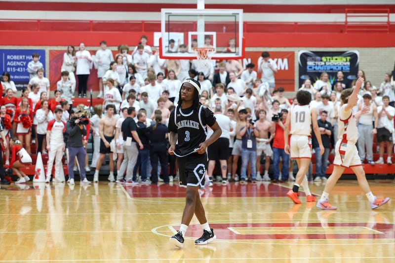 Kankakee's Cedric Terrell III leaves the court as Morton celebrates in the background following the Kays' 61-48 loss to Morton in the IHSA Class 3A Ottawa Sectional championship on Friday, March 6, 2026.