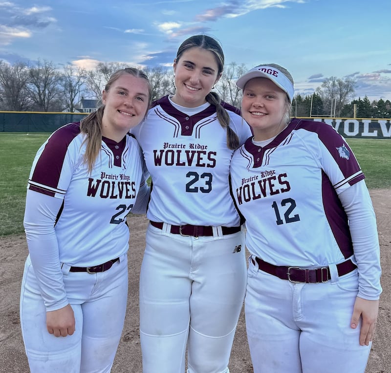 Reese Vrba (left) homered twice, including a walk-off home run in the ninth inning, Reese Mosolino (center) struck out eight batters over nine innings pitched and Bella Moore (right) hit a game-tying home run during Prairie Ridge's softball victory over Jacobs.