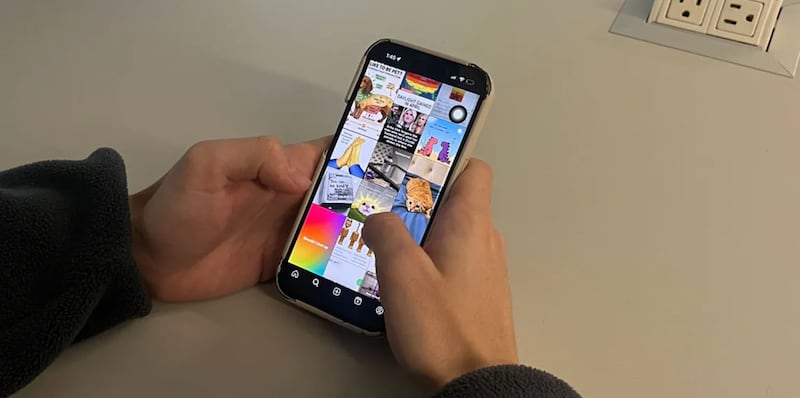 A student uses his phone in school