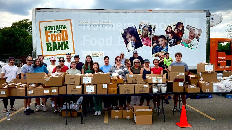 The volunteers outside the mobile food pantry event held in Seneca by the Village Christian Church and the Northern Illinois Food Bank.