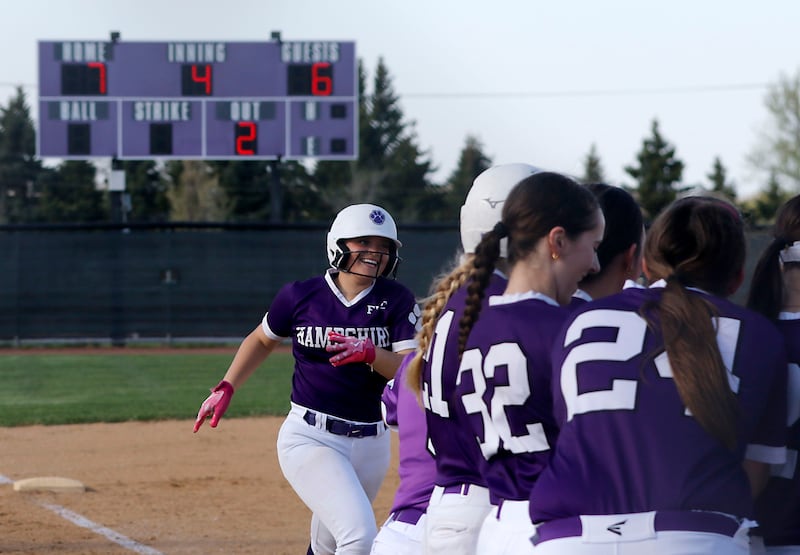 Hampshire's Addi Edlen smiles as she runs home after hitting a home run during a Fox Valley Conference softball game against Burlington Central on Tuesday, April 21, 2026, at Hampshire High School.